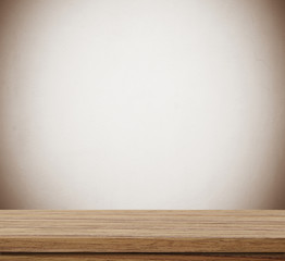Empty wooden table over blue cement wall  background