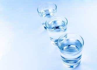top of view of three drink glasses with water, nutrition and health-care concept