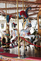Beautiful white horses on a merry go round