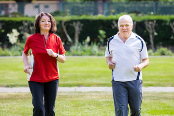 Couple Running In Park