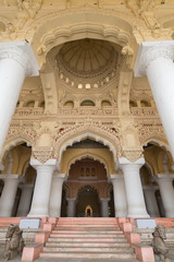 Madurai, India - October 21, 2013: Massive dome and extremely decorated ceiling over the throne at Nayak Palace. Stairs lead up to the audience hall. 