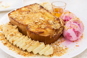 Honey toasts with banana , vanilla and strawberry ice-cream - dessert