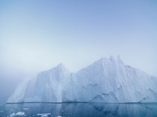 huge icebergrs are on the arctic ocean at Greenland