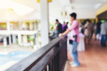 Blurred background of people waiting at balcony