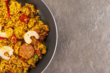 Chorizo chicken and king prawn paella in a frying pan