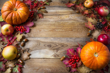 Thanksgiving or fall concept with pumpkins and apples, copy spac