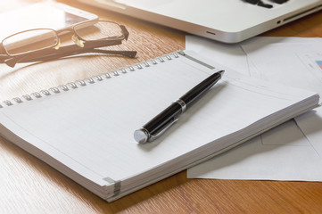 Blank notebook, Notebook with a pen on the office desk, business concept.