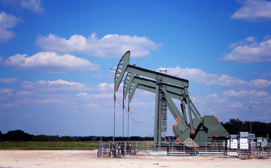 Oil Pumps on the field. Oil industry equipment.