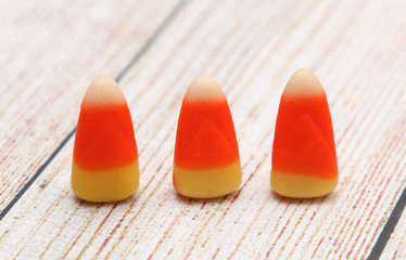 Candy Corn isolated on a Light Wood Table