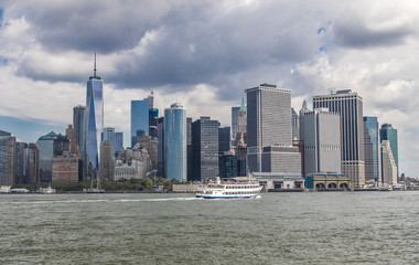 Downtown Manhattan under cloudy skies.