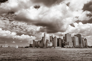 Downtown Manhattan under cloudy skies.