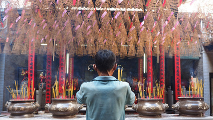 Man worship in chinese pagoda in china town, Ho Chi Minh city, V