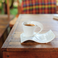 Cup of coffee on table in cafe