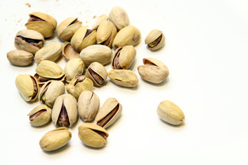  Pistachio in white background / Wonderfully delicious pistachio nuts have long been revered as the symbol of wellness and robust health since ancient times