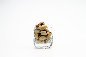  Pistachio in white background / Wonderfully delicious pistachio nuts have long been revered as the symbol of wellness and robust health since ancient times