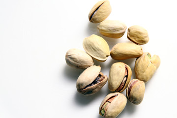  Pistachio in white background / Wonderfully delicious pistachio nuts have long been revered as the symbol of wellness and robust health since ancient times