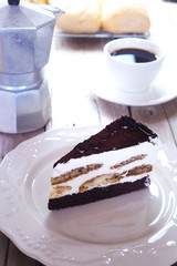 Close up of Tisamisu layer cake on a white plate.