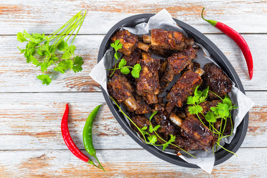 ribs seasoned with spicy garlic ginger barbecue sauce amd cilant