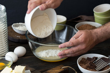 Chef mixes food ingredients for cooking chocolate dessert