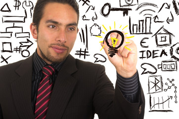 young handsome businessman writing on whiteboard with marker