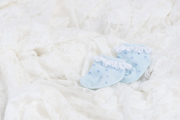 Obraz na płótnie Canvas Blue baby socks for new born baby