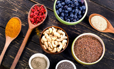 Super foods on a dark wooden background