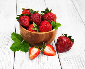 ripe strawberries on wooden table