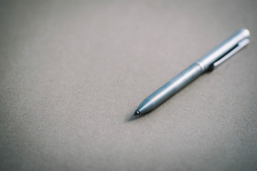 Vintage pen on brown paper,close-up