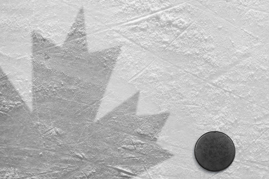 Hockey puck and maple leaf