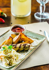 kebab with potatoes and salad