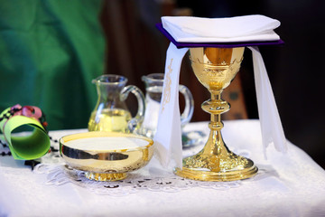 Golden chalice on the altar during the mass