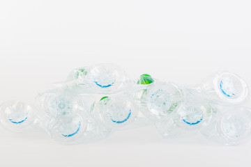 Recyclable garbage of plastic bottles on white background