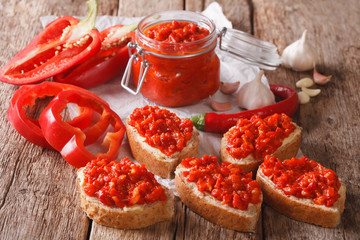 traditional Balkan ajvar from peppers with garlic close-up. horizontal
