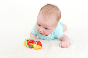 2 months cute baby girl with rattle
