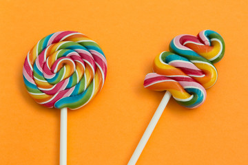 Two lollipops with many colors in a spiral