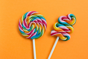 Two lollipops with many colors in a spiral