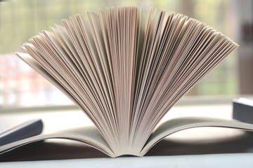 Open book with pages split on a white background.