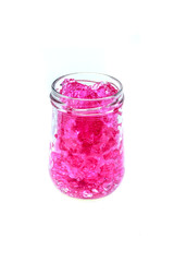 pink hydrogel  in glass bottle isolated on white background