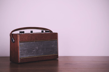 Old retro style radio on a wooden surface Vintage Retro Filter.