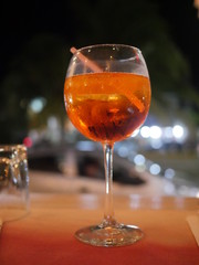 orange drink in wineglass