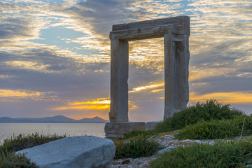 Fototapeta premium Amazing sunset in Naxos, Cyclades, Greece. The incredible gate (