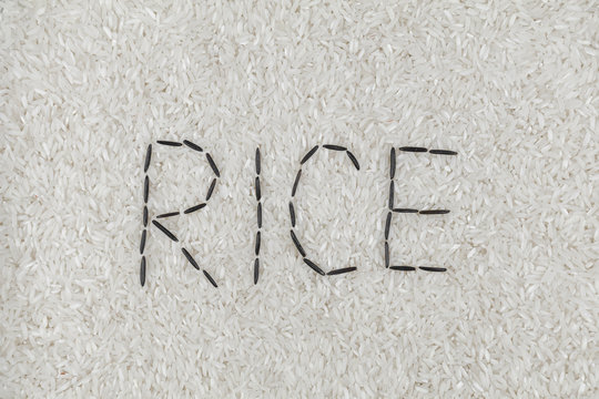 word rice lined with black rice on white rice background