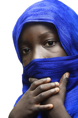 Fototapeta premium Beauty of Africa Veiled by a Blue Typical Arab Clothing (Tuareg)