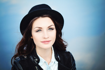 Cute Brunette Woman in Black Hat Outdoors