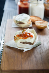 burger on a wooden chopping board