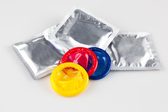 multicolored condoms on packing and without packing