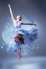 Fototapeta premium The beautiful ballerina dancing in blue long dress 