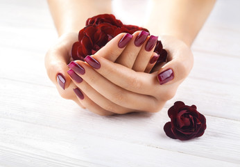 vinous manicure with rose flowers. spa - obrazy, fototapety, plakaty