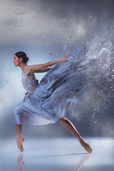 The beautiful ballerina dancing in blue long dress  - obrazy, fototapety, plakaty