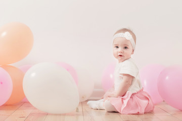 beautiful little girl with balloons